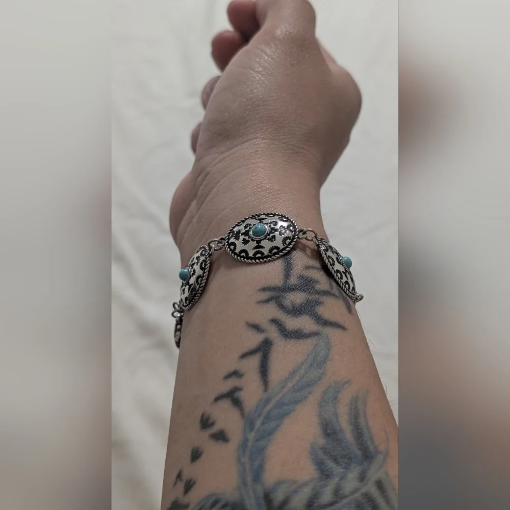 Intricate Silver Bracelet with Turquoise Accents